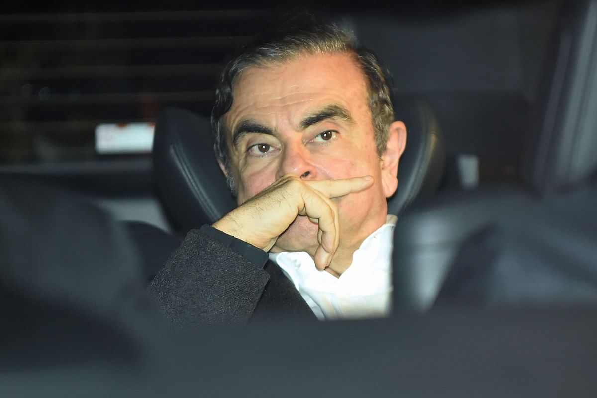 In this file photo taken on 6 March 2019, former Nissan chairman Carlos Ghosn leaves his lawyers` offices after he was released earlier in the day from a detention centre after posting bail in Tokyo. Photo: AFP