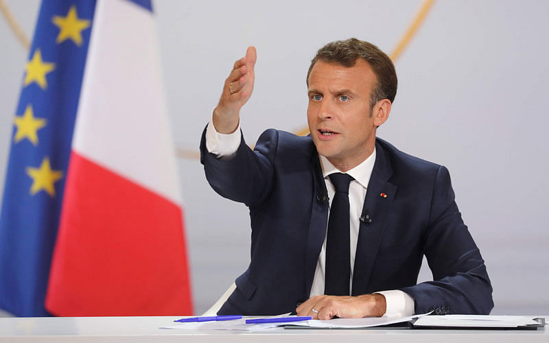 French president Emmanuel Macron gestures during his live address following the “Great National Debate”, at the Elysee Palace in Paris on 25 April. Photo: AFP