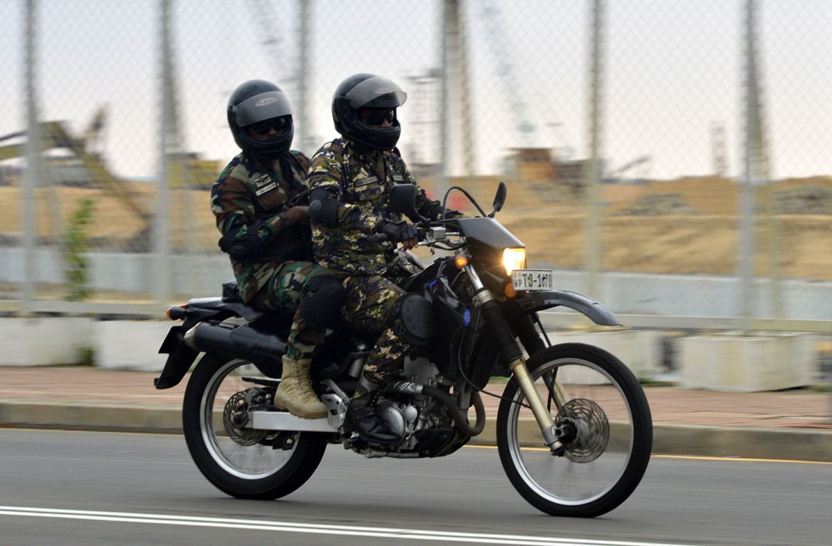 Two soldiers on a motorbike patrol along a street in Colombo on 25 April, 2019, following a series of bomb blasts targeting churches and luxury hotels on the Easter Sunday in Sri Lanka. Photo: AFP