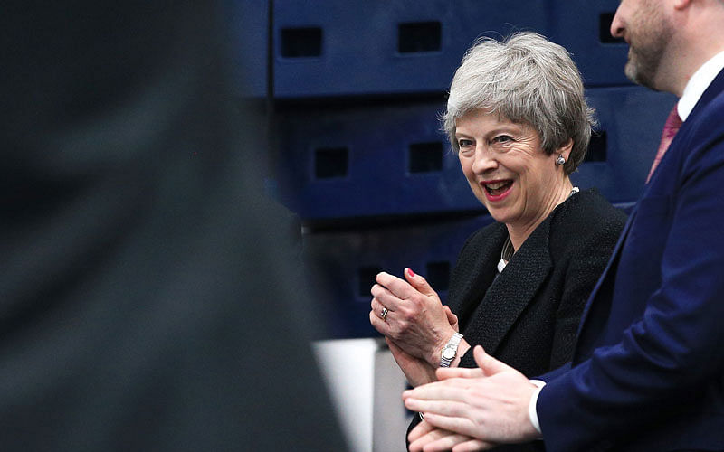 Britain’s Prime Minister Theresa May gestures during a visit to the Leisure Box in Brierfield, Lancashire, on 25 April 2019, during campaigning for the local elections. Photo: AFP
