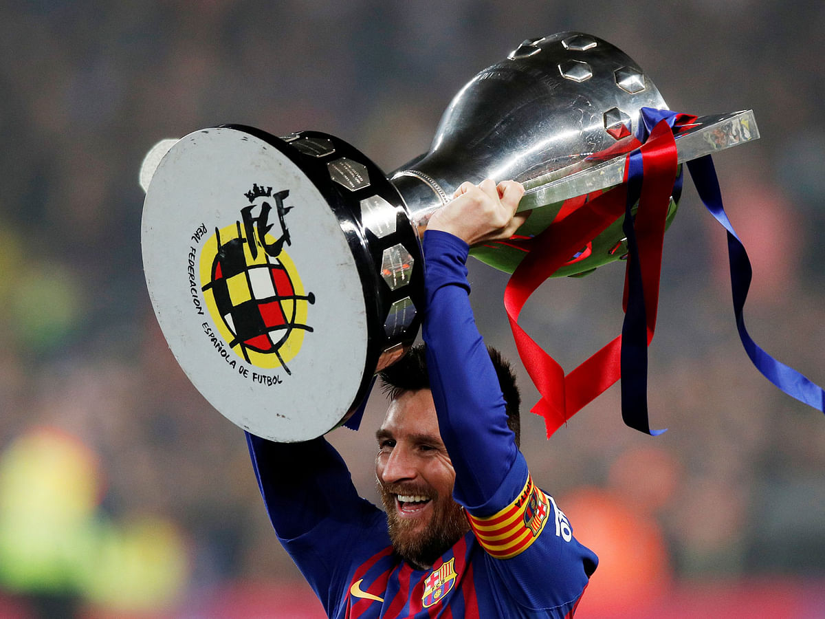 Barcelona`s Lionel Messi celebrates winning La Liga with the trophy after winning the match against Levante at Camp Nou, Barcelona, Spain on 27 April 2019. Photo: Reuters