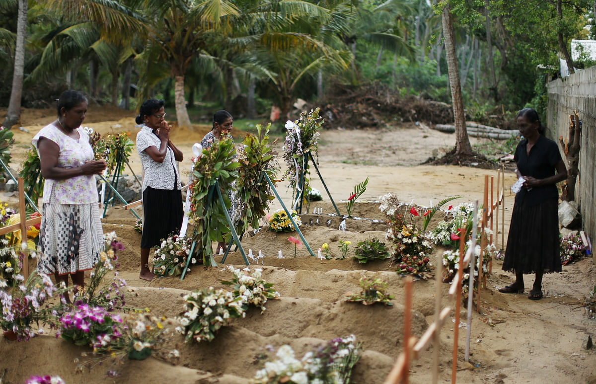 People react during mass burials near St. Sebastian church in Negombo, Sri Lanka on 28 April 2019. Photo: Reuters