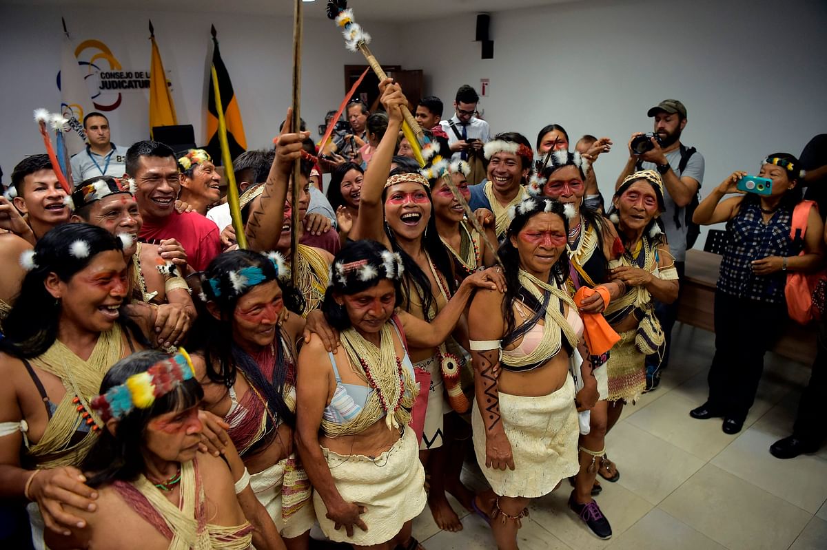 Waorani indigenous people celebrate after a court ruled in their favour on the tribe`s legal challenge to the government`s land selloff, at the end of the protection action hearing in Puyo, Ecuador, on 26 April 2019. Photo: AFP