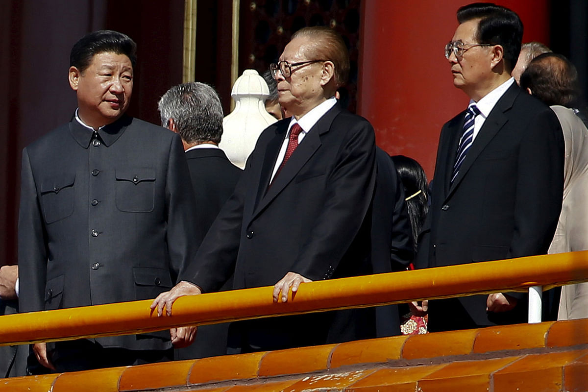 Former Chinese president Jiang Zemin stands between president Xi Jinping (L) and former president Hu Jintao (R) during a military parade to mark the 70th anniversary of the end of World War Two, in Beijing, China on 3 September 2015. Photo: Reuters