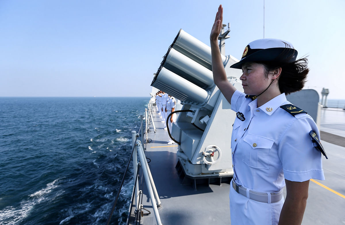 A Chinese soldier waves farewell to Russian fleets as the Chinese-Russian joint naval drill concludes in Zhanjiang. Photo: Reuters