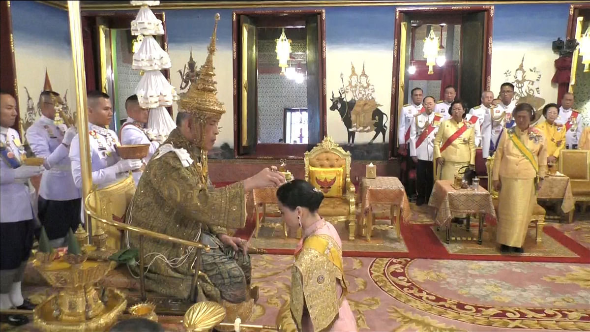 Thailand`s King Maha Vajiralongkorn and Queen Suthida attend his coronation in Bangkok, Thailand, on 4 May 2019 in this still image taken from TV footage. Reuters