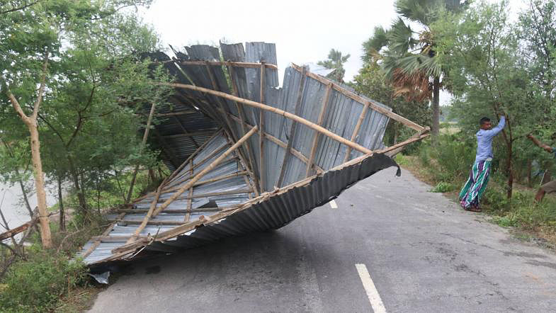 Part of a house that has been destroyed by cyclonic storm Fani remains on a road of Patharghata, Khulna on 4 May, 2019. Photo: Saddam Hossain