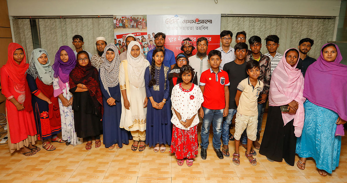 Beneficiaries of Meril-Prothom Alo Trust pose for a photograph at a get-together programme at CA Bhaban in Karwan Bazar. Photo: Dipu Malakar.