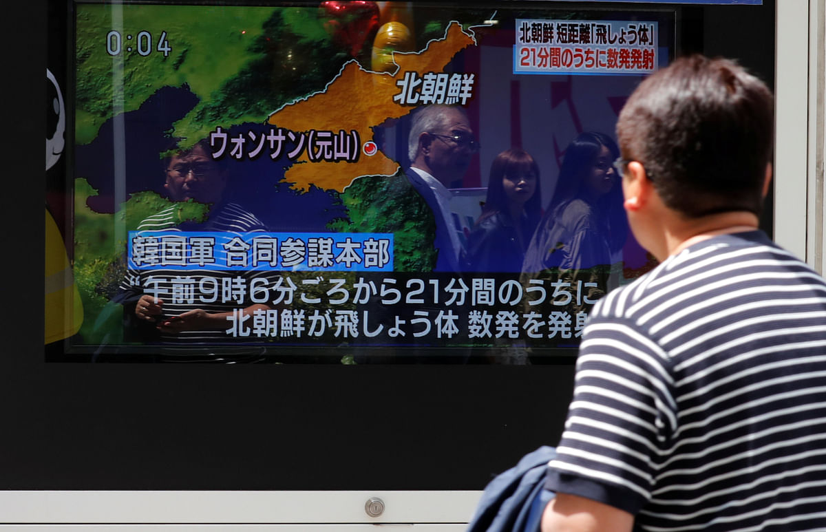 A man watches a television screen showing a news report on North Korea firing several short-range projectiles from its east coast, on a street in Tokyo, Japan on 4 May 2019. Reuters