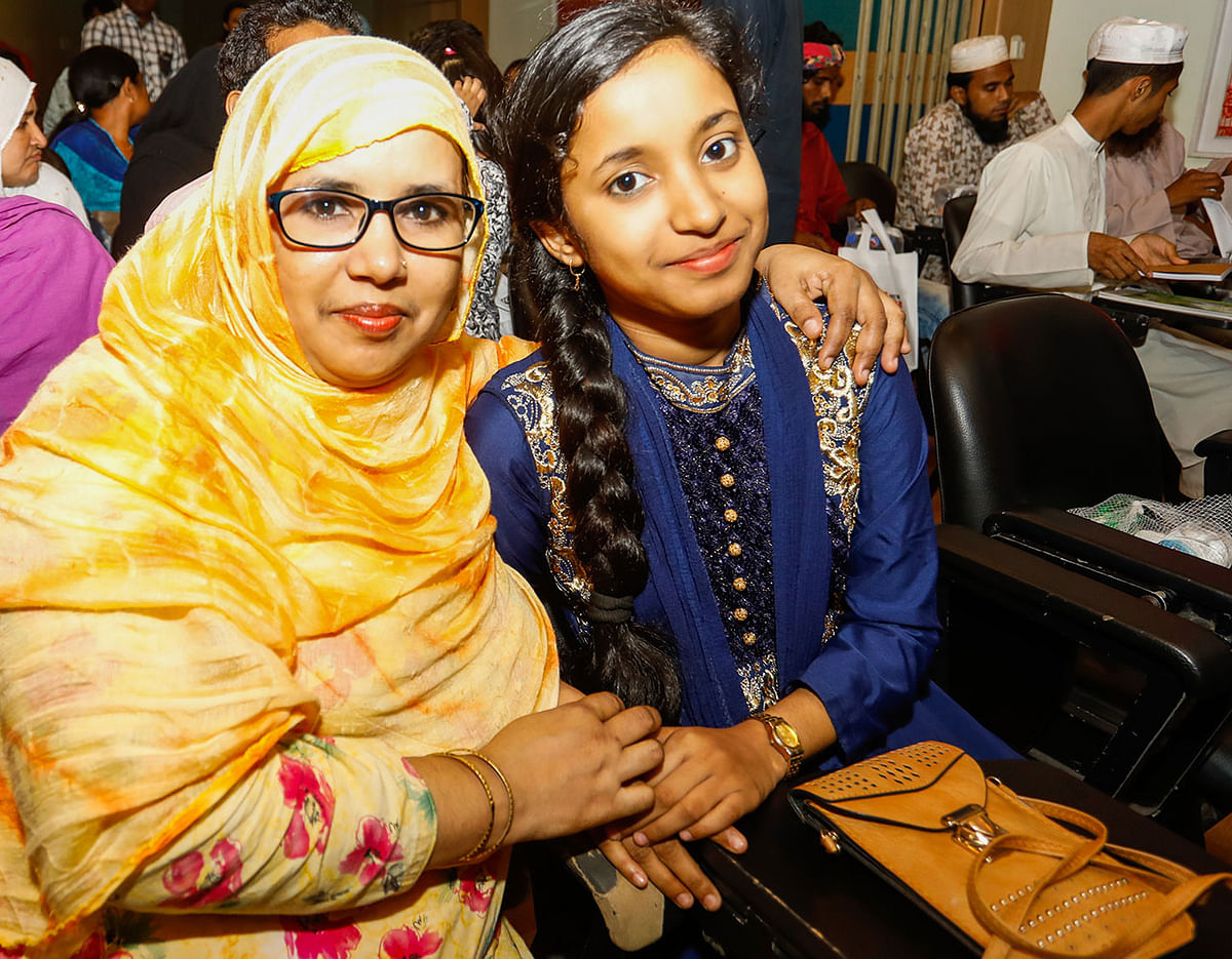 Khadiza Akhter Mily who gets regular stipend from Prothom Alo Trust poses with her mother Rokeya Parvin . Khadiza wants to be a doctor to fulfill her father’s dream who was killed in Rana Plaza tragedy. Photo: Dipu Malakar