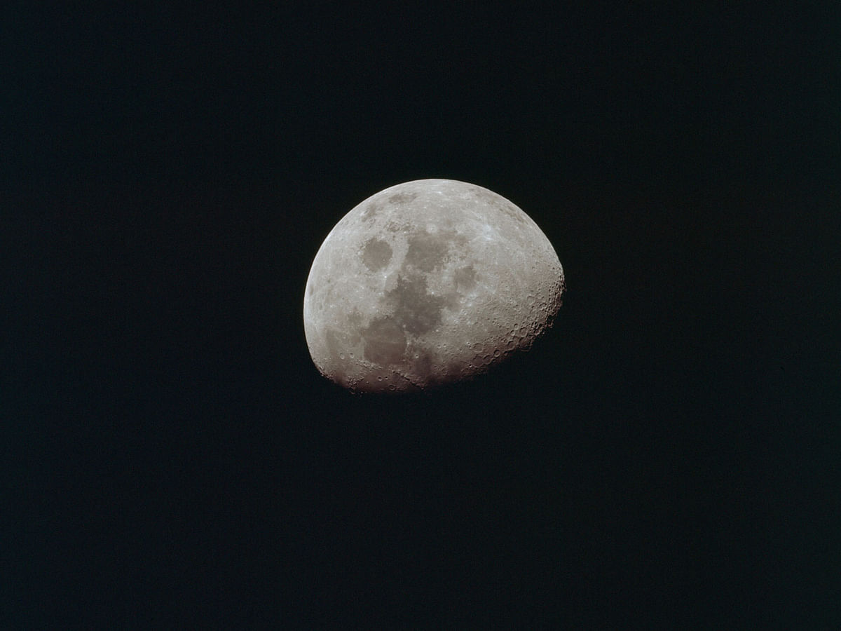 The moon is seen from the Apollo 10 spacecraft, with the Sea of Tranquility visible as a large, dark area near the center of the photograph, 24 May 1969. Photo: Reuters