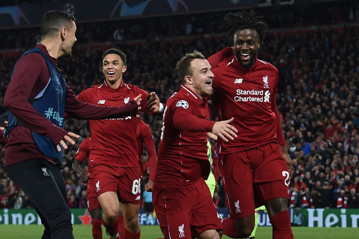 Liverpool`s Belgium striker Divock Origi (R) celebrates wtih Liverpool`s Swiss midfielder Xherdan Shaqiri after scoring their fourth goal during the UEFA Champions league semi-final second leg football match between Liverpool and Barcelona at Anfield in Liverpool, north west England on 7 May 2019. Photo: AFP
