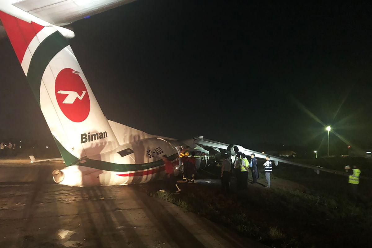 This handout picture taken and released by Myanmar Department of Civil Aviation on 8 May 2019 shows a Biman Bangladesh airlines passenger aircraft after it slid off a runway at Yangon International airport in Yangon. Photo: AFP
