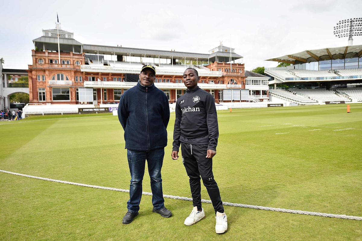 anut Massanja (L), Team Leader of Tanzania and Tanzania player Kudrack (R) pose in front of the Lords Pavilion before the Street Child Cricket World Cup Final at Lords Cricket Ground in London on 7 May 2019. Photo: AFP