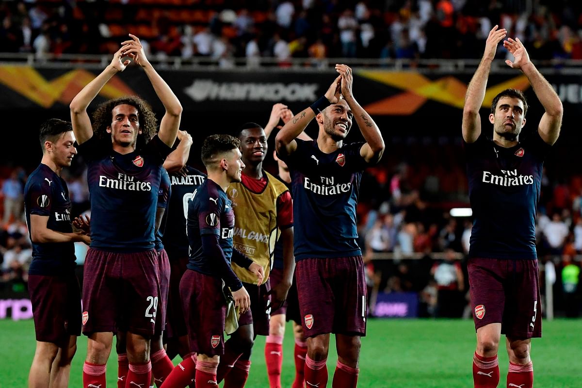 Arsenal's players celebrate at the end of the UEFA Europa League semi-final second leg football match between Valencia CF and Arsenal FC at the Mestalla stadium in Valencia on 9 May, 2019. Photo: AFP
