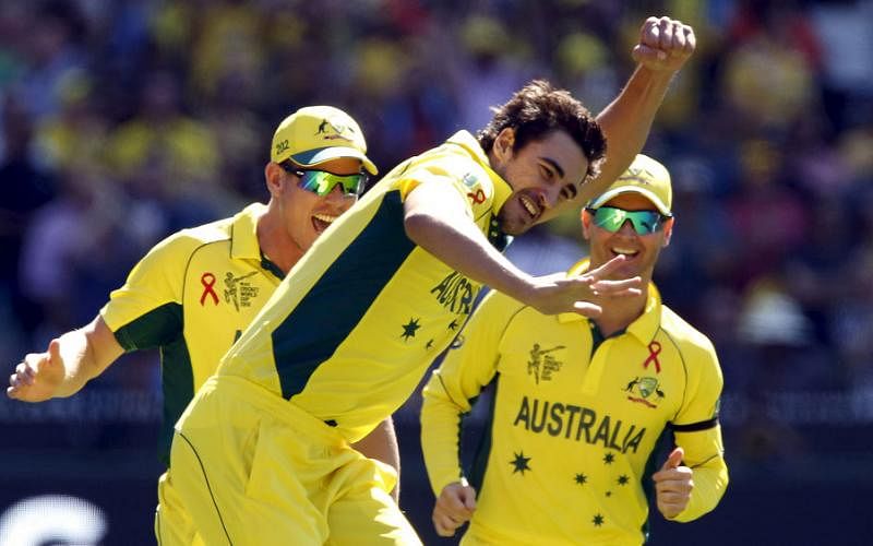 Australia`s Mitchell Starc (C) celebrates with team mates James Faulkner (L) and captain Michael Clarke after bowling New Zealand`s captain Brendon McCullum for a duck during their Cricket World Cup final match at the MCG on 29 March 2015. Reuters File Photo
