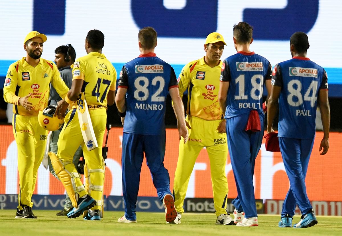 Chennai Super Kings cricket captain Mahendra Singh Dhoni (3R) celebrates as he greets Delhi Capitals teammembers after winning the match during the 2019 Indian Premier League (IPL) second qualifier Twenty20 cricket match between Delhi Capitals and Chennai Super Kings at the Dr. YS Rajasekhara Reddy ACA-VDCA Cricket Stadium in Visakhapatnam on 10 May 2019. Photo: AFP