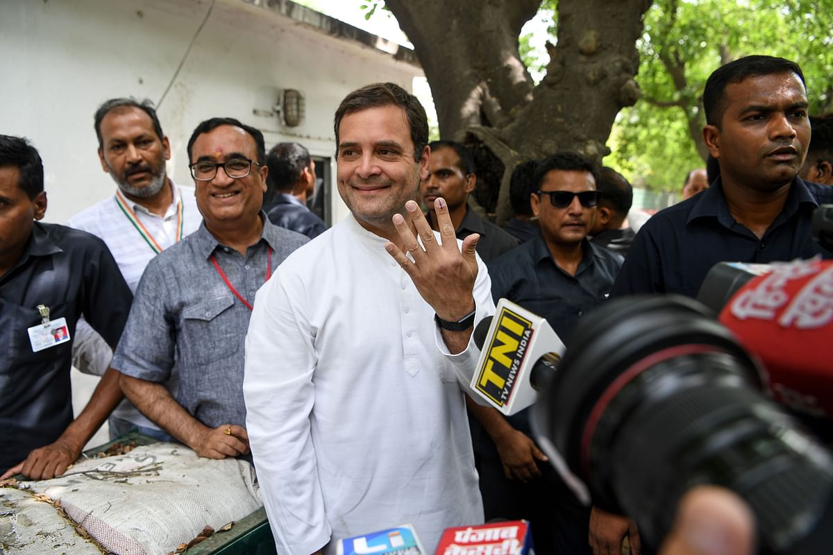 Indian National Congress president Ragul Gandhi shows his ink-marked finger after casting his vote at a polling station in New Delhi on 12 May 2019. Fifty-nine seats are up for grabs across the country on the sixth voting day of the marathon ballot. Photo: AFP