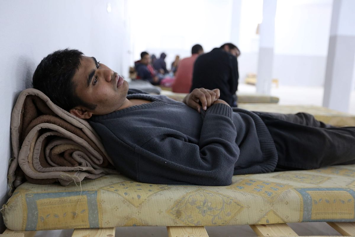 One of the survivors of a boat carrying migrants sunk in the Mediterranean during the night of 9 and 10 May, rests at a shelter in the Tunisian coastal city of Zarzis on 11 May 2019. Photo: AFP