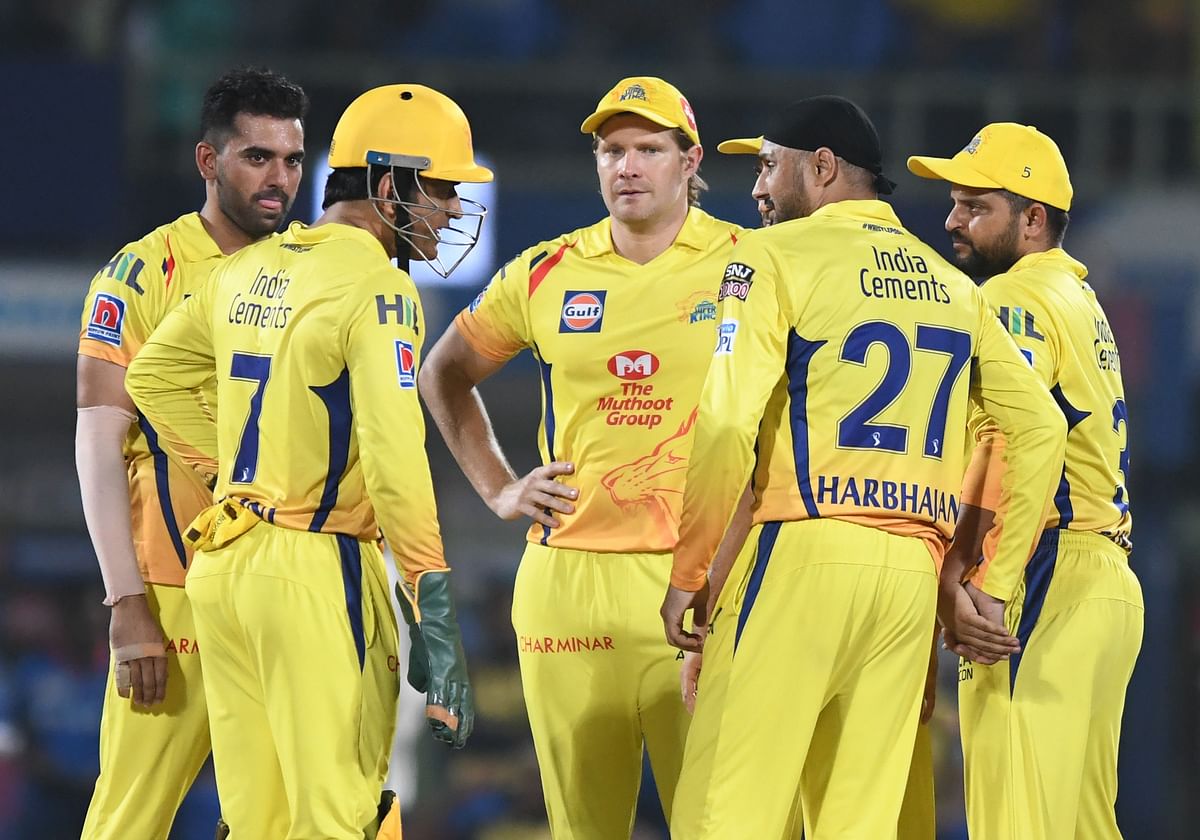 Chennai Super Kings cricketer Harbhajan Singh (2R) celebrates with teammate captain Mahendra Singh Dhoni (L) for the wicket of Delhi Capitals batsman Sherfane Rutherford (unseen) during the 2019 Indian Premier League (IPL) second qualifier Twenty20 cricket match between Delhi Capitals and Chennai Super Kings at the Dr YS Rajasekhara Reddy ACA-VDCA Cricket Stadium in Visakhapatnam on 10 May 2019. Photo: AFP