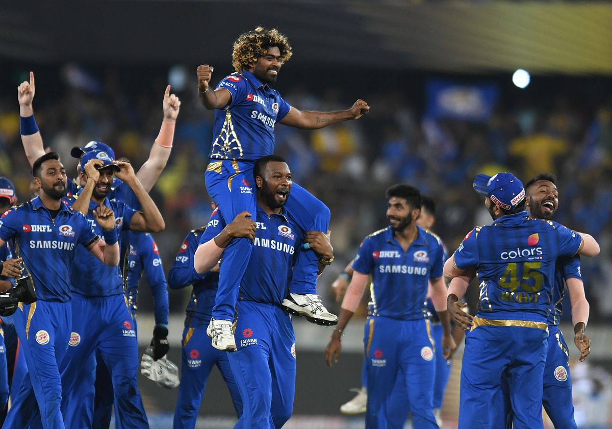 Mumbai Indians cricketer Lasith Malinga (C top) is carried as the team celebrates after winning the 2019 Indian Premier League (IPL) Twenty20 final cricket match between Mumbai Indians and Chennai Super Kings at the Rajiv Gandhi International Cricket Stadium in Hyderabad on 12 May, 2019. Photo: AFP