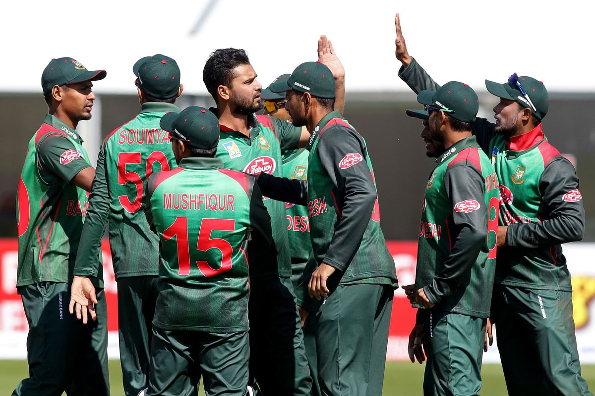 Bangladesh`s captain Mashrafe Mortaza (C) celebrates with teammates after taking the wicket of West Indies` Sunil Ambris (not pictured) during the Tri-Nation Series, one day international between Bangladesh and West Indies Malahide cricket club, in Dublin on 13 May 2019. Photo: AFP