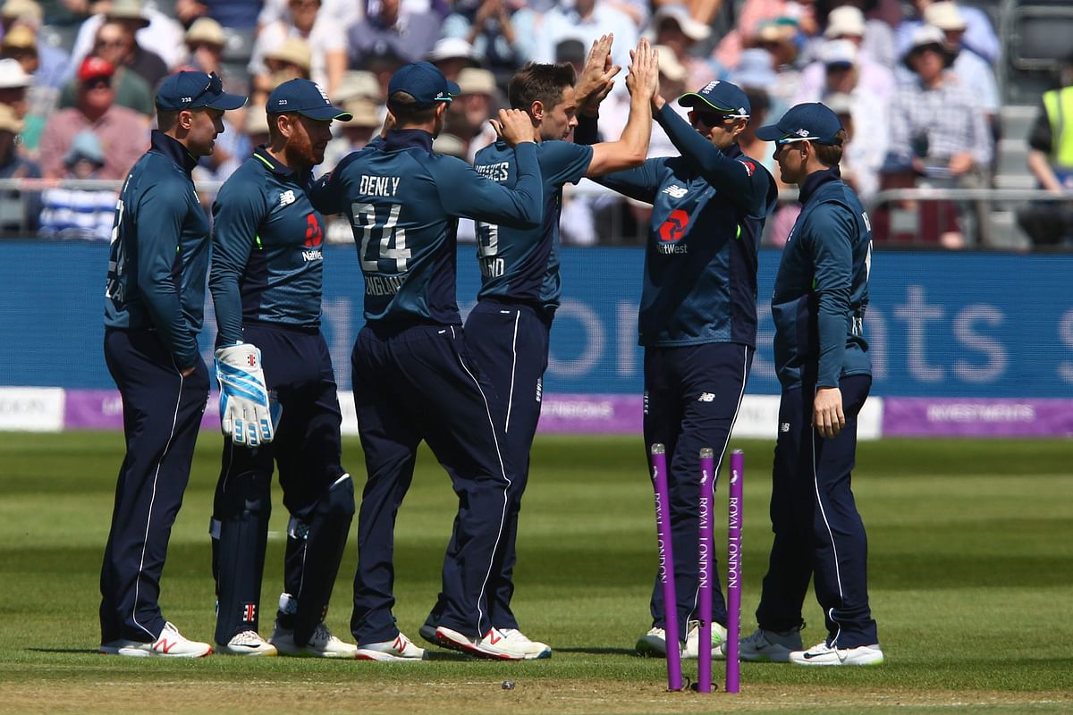 England`s Chris Woakes (C) celebrates taking the wicket of Pakistan`s Babar Azam during the third One Day International (ODI) cricket match between England and Pakistan at The Bristol County Ground, Bristol, southwest England on 14 May 2019. Photo: AFP