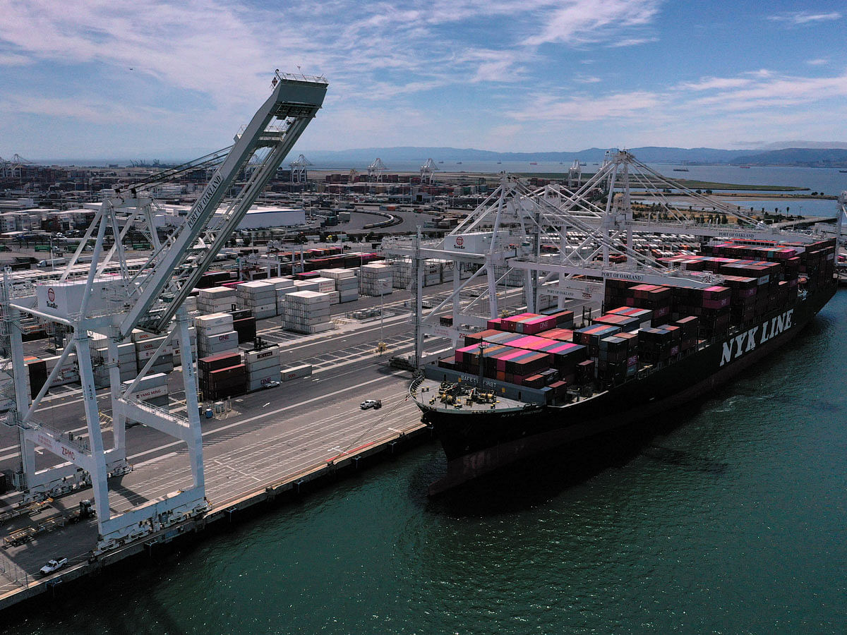 A container ship sits docked at the Port of Oakland on 13 May in Oakland, California. Photo: AFP