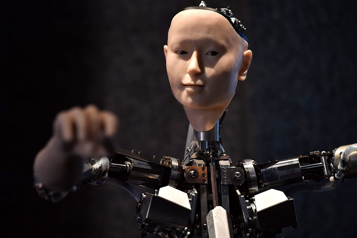 An AI robot with a humanistic face, entitled Alter 3: Offloaded Agency, is pictured during a photocall to promote the forthcoming exhibition entitled `AI: More than Human`, at the Barbican Centre in London on 15 May 2019. Photo: AFP
