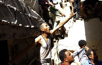 Yemenis sift the rubble of a heavily damaged building following reported Saudi-led coalition air strikes in the Yemeni capital Sanaa on 16 May 2019. Saudi-led coalition warplanes struck Yemeni rebel targets, including in the capital Sanaa, today two days after the insurgents claimed drone strikes that shut a key oil pipeline in the neighbouring kingdom. Photo: AFP