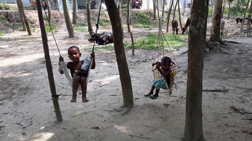 Two children playing on a swing, 16 May, Sirajganj Sadar upazila. Photo: Sajedul Alam