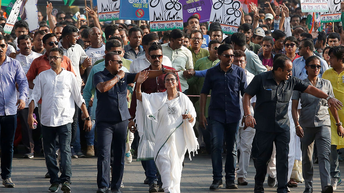 Mamata Banerjee, the chief minister of West Bengal and chief of Trinamool Congress (TMC), waves towards her supporters during a road show ahead of the last phase of India`s general election in Kolkata, India on 16 May 2019. Photo: Reuters