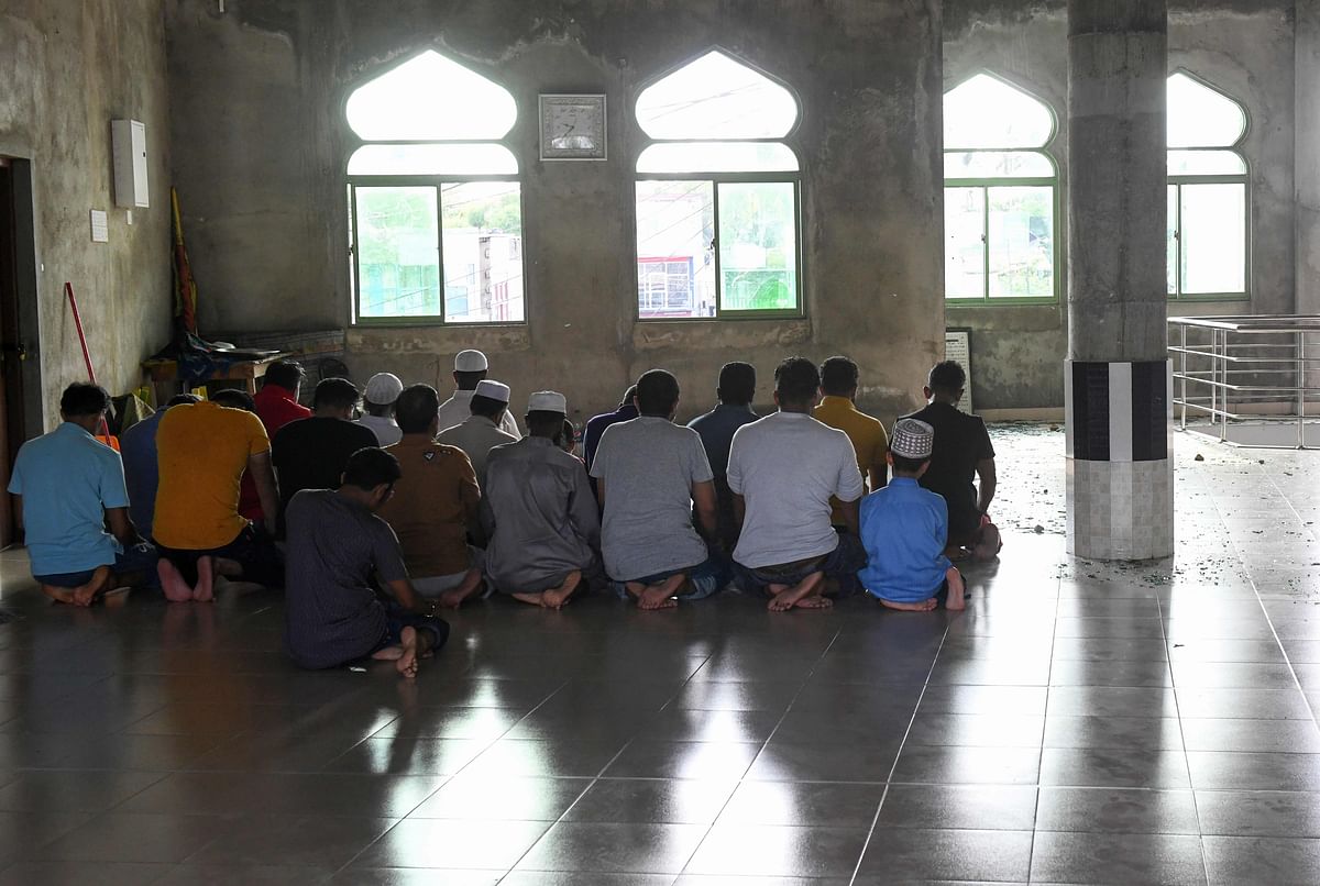 Sri Lankan Muslims attend a prayer at the Jumha mosque after a mob attack, in Minuwangoda on 15 May. Photo: AFP