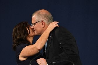 Sydney : Australia`s prime minister Scott Morrison (R) kisses his wife Jenny (L) following a victory speech after winning the Australia`s general election in Sydney on 18 May 2019. Australia`s ruling conservative coalition appeared to secure a shock election win on 18 May with the party predicted to have defied expectations and retained power. Photo: AFP
