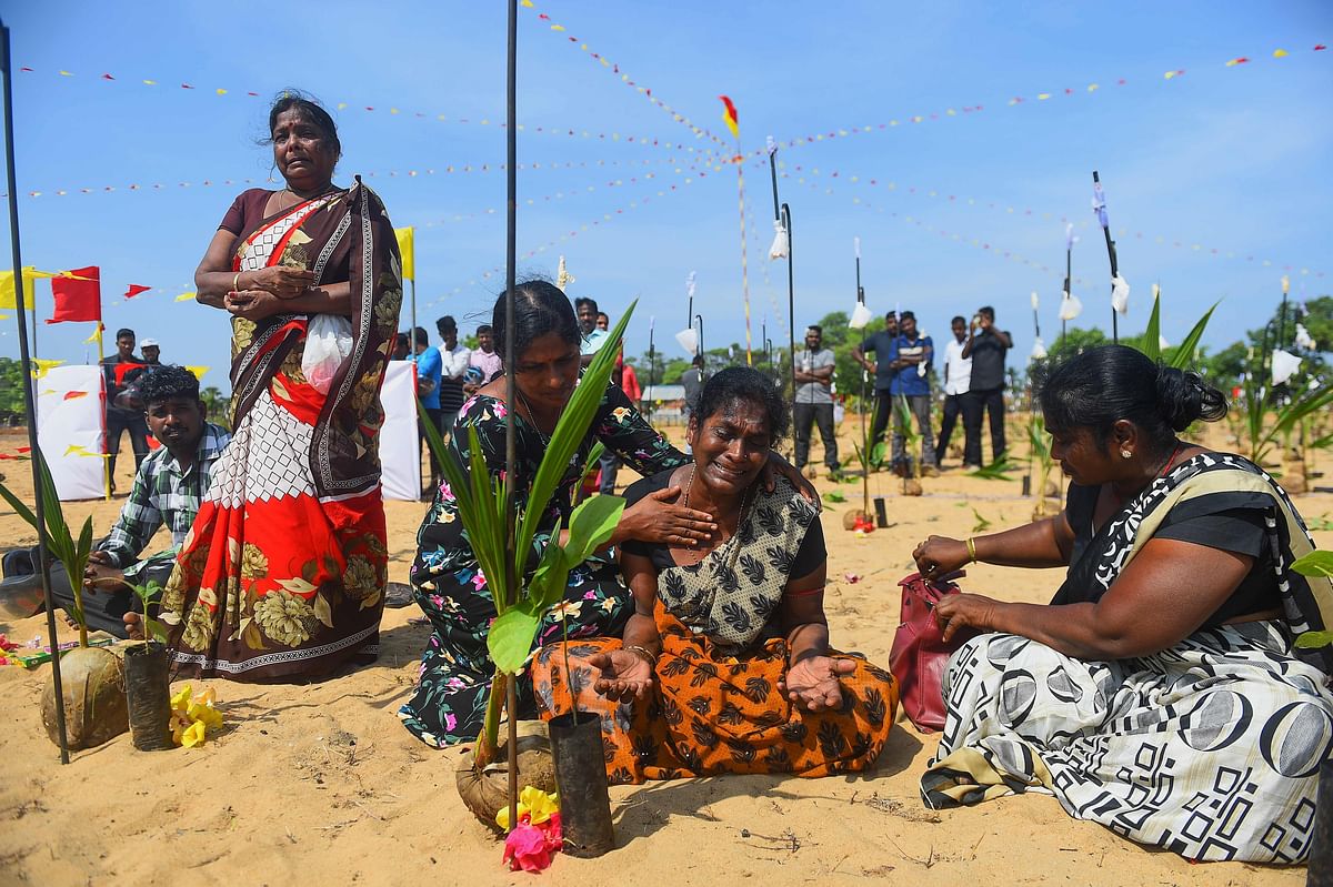 A Sri Lankan Tamil woman reacts as she takes part in a ceremony at Mullaivaukkal on the outskirts of Jaffna on 18 May 2019. Photo: AFP