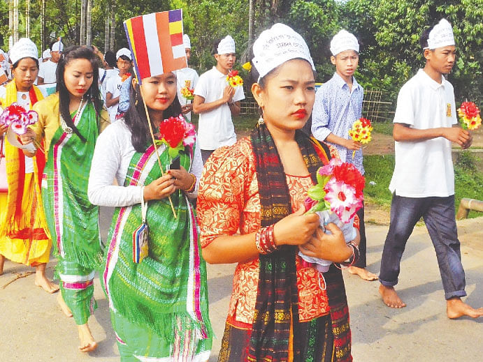 Wishing welfare of all country, nation and creatures, Parbatya Bhikkhu Sangha brings out a procession in Dighinala, Khagrachhari on Friday morning. Photo: Palas Barua