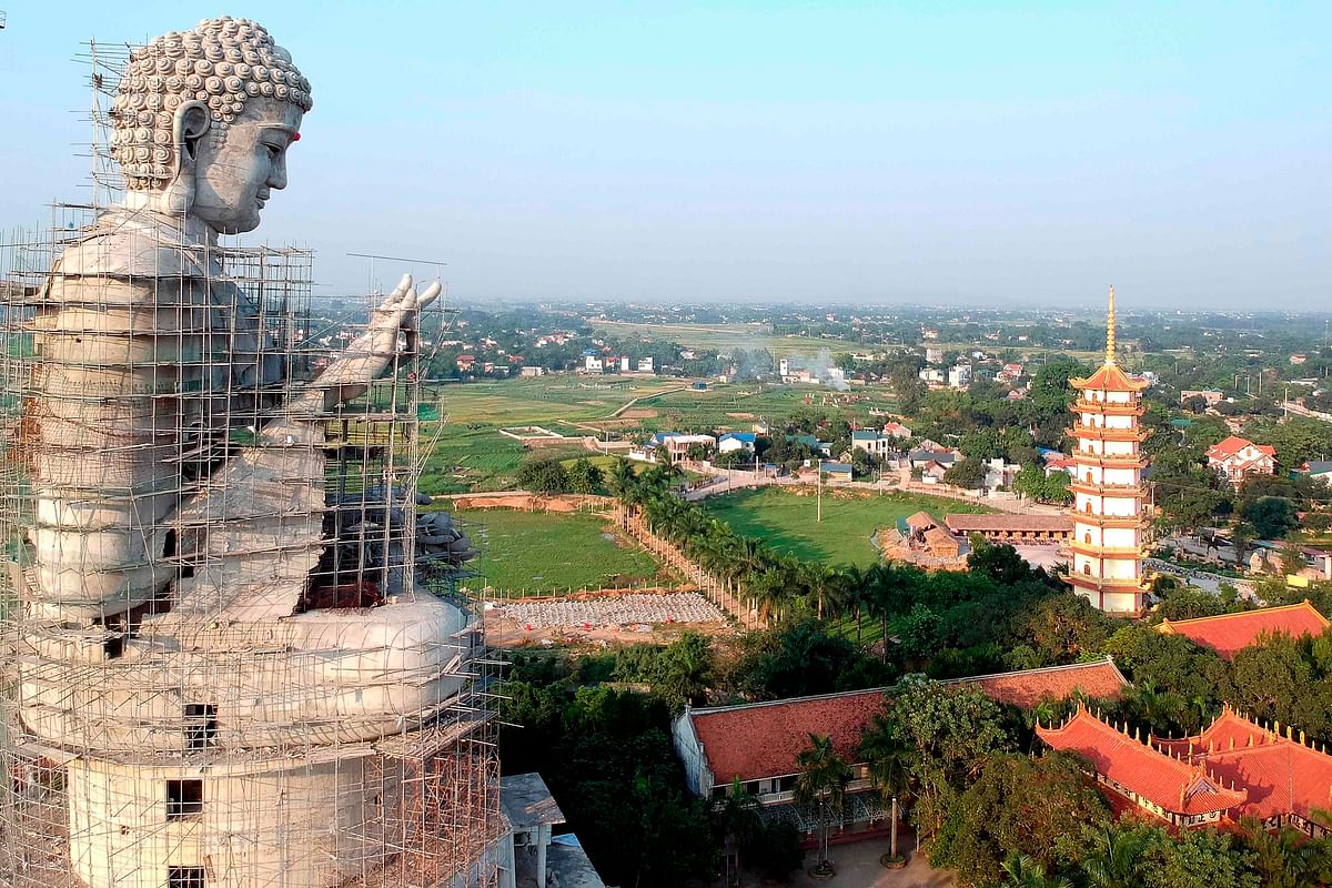 This aerial photograph shows a giant under-construction Buddha statue at Khai Nguyen pagoda in Son Tay on the outskirts of Hanoi on 18 May 2019 on the eve of Vesak day or Buddha day festival, marking the birth of Gautama Buddha, his attaining enlightenment, and his passing away. Photo: AFP