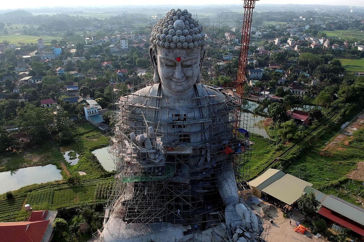 This aerial photograph shows a giant under-construction Buddha statue at Khai Nguyen pagoda in Son Tay on the outskirts of Hanoi on 18 May 2019 on the eve of Vesak day or Buddha day festival, marking the birth of Gautama Buddha, his attaining enlightenment, and his passing away. Photo: AFP