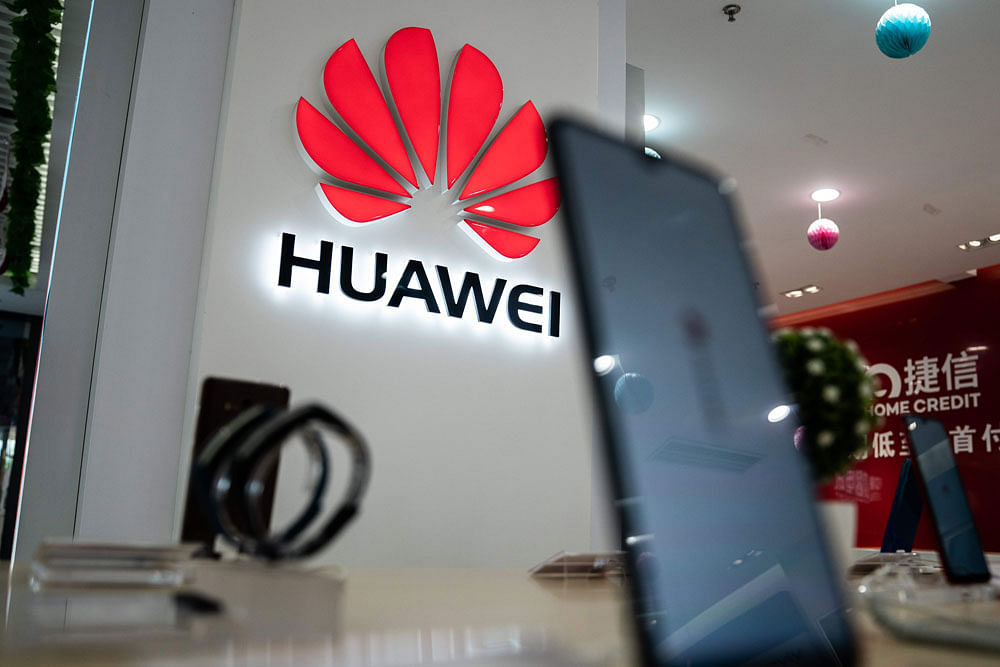 A Huawei logo is displayed at a retail store in Beijing on 20 May, 2019. Photo: AFP