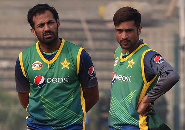 Pakistani cricketers Wahab Riaz and Mohammad Amir in a team practice session. Photo: AFP