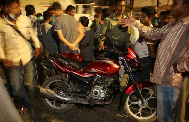 The motorcycle hit by a truck seen at Asad Gate in Dhaka on Sunday night. Photo: Zahidul Karim