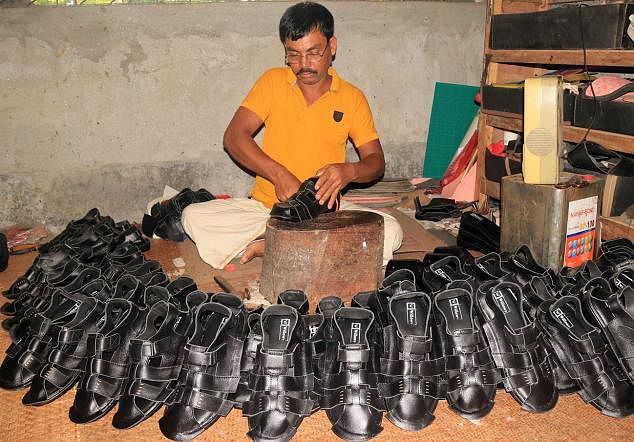 A local shoemaker making slippers at his factory in Adarsha Nagar of Cumilla city on 21 May, 2019. Photo: Emdadul Haque