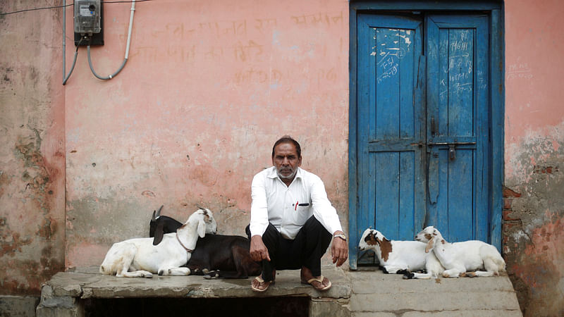 Jabbar Ali, a carpenter, sits outside a house in village Nayabans in the northern state of Uttar Pradesh, India on 15 May 2019. Reuters