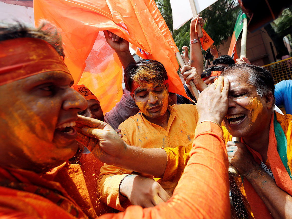 JP supporters celebrate after learning the initial election results outside the party headquarters in New Delhi, India, 23 May 2019. Photo: Reuters