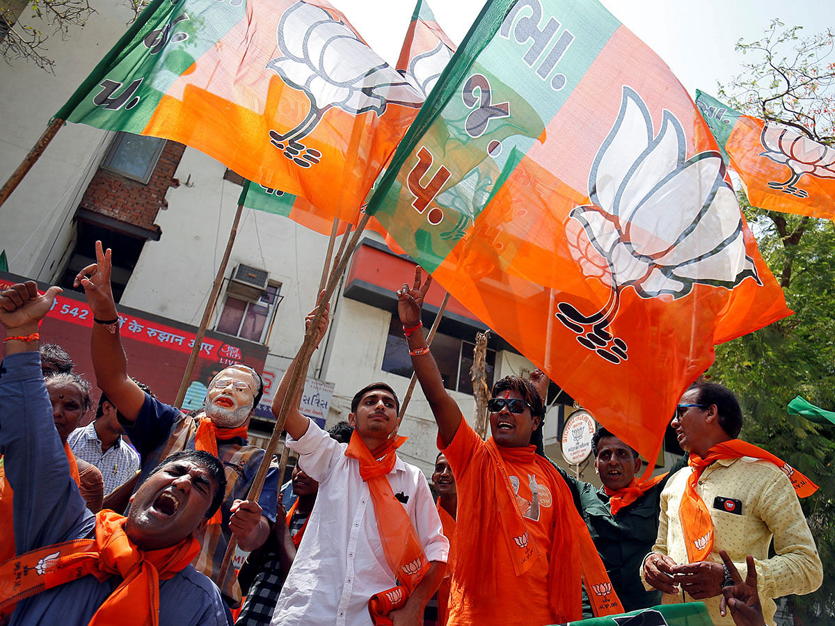 Supporters of Bharatiya Janata Party (BJP) celebrate after learning of initial poll results in Ahmedabad, India, on 23 May 2019. Reuters