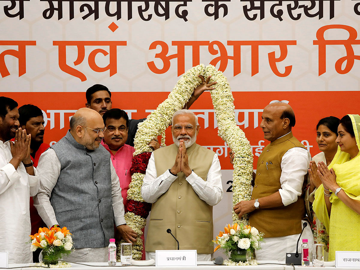 India`s Prime Minister Narendra Modi gestures as he is presented with a garland during a thanksgiving ceremony by Bharatiya Janata Party (BJP) leaders to its allies at the party headquarters in New Delhi, India, on 21 May 2019. Reuters File Photo