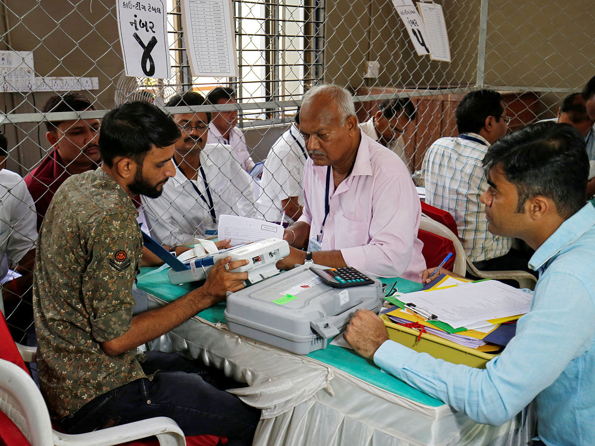 Election staff members count votes inside a vote counting centre in Ahmedabad, India, on 23 May 2019. Reuters