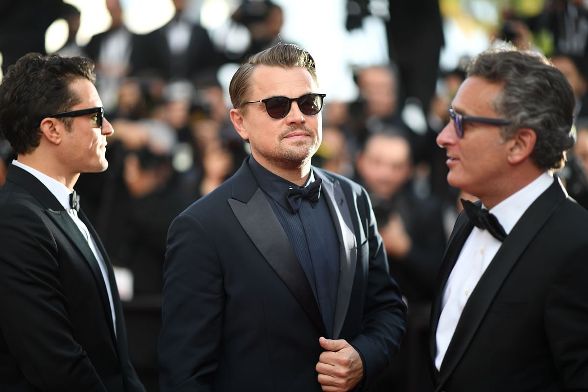 British actor Orlando Bloom (L) and US actor Leonardo DiCaprio (C) arrive for the screening of the film `The Traitor (Il Traditore)` at the 72nd edition of the Cannes Film Festival in Cannes, southern France, on 23 May, 2019. Photo: AFP