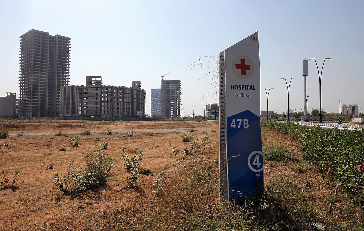 A signboard is pictured in front of buildings under construction at the Gujarat International Finance Tec-City (GIFT) at Gandhinagar, in the western state of Gujarat, India, on 18 March 2019. Photo: Reuters