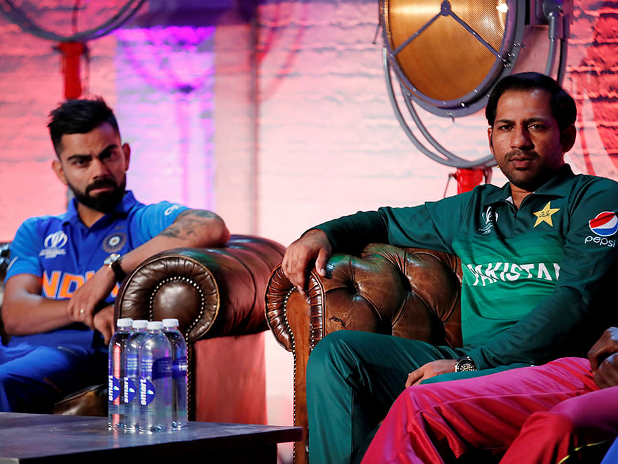 Pakistan`s Sarfaraz Ahmed and India`s Virat Kohli during the Captains Press Conference ahead of the ICC Cricket World Cup at The Film Shed, London, Britain on 23 May 2019. Reuters File Photo